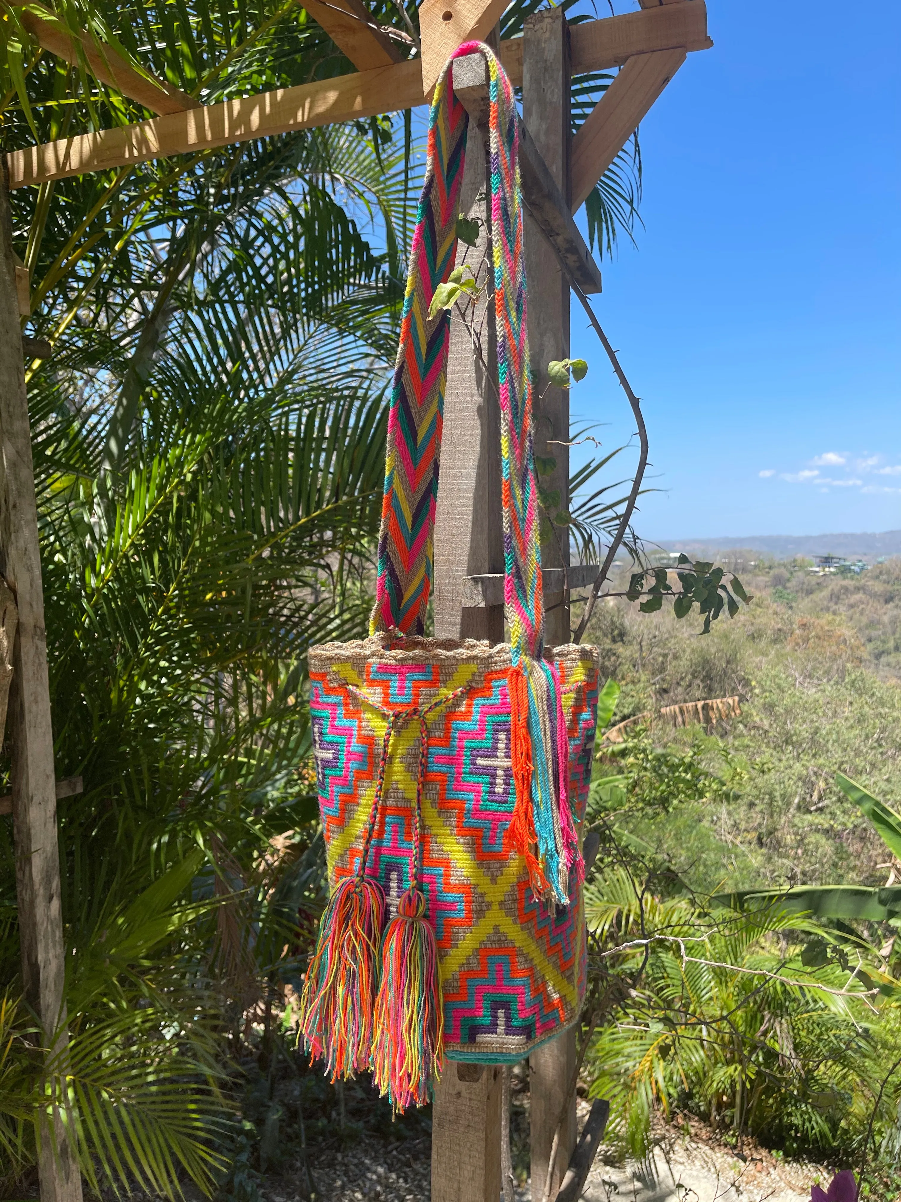 Pastel Geometric Designs on Beige Mochila